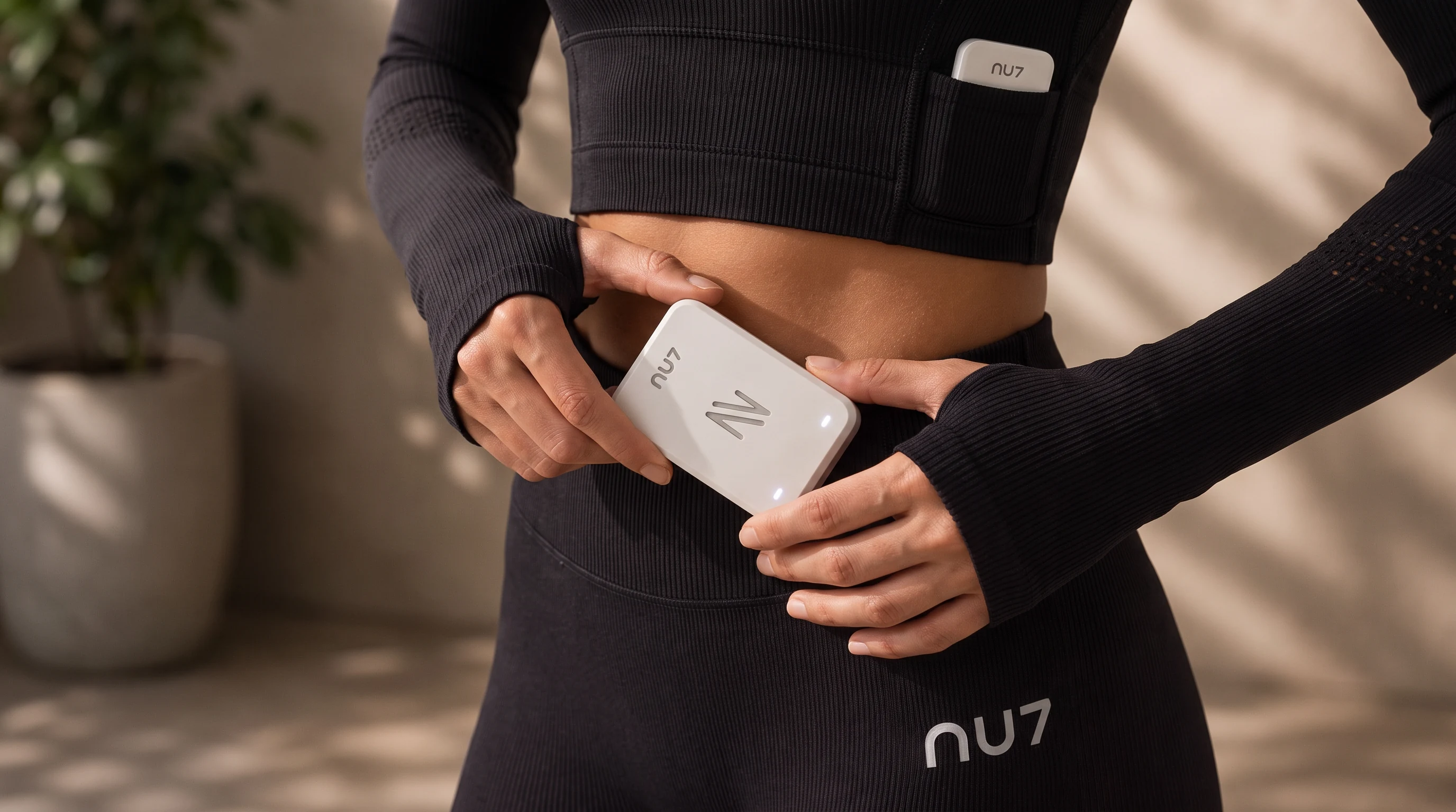 Clipping the NU7 X1 module into the leggings waistband